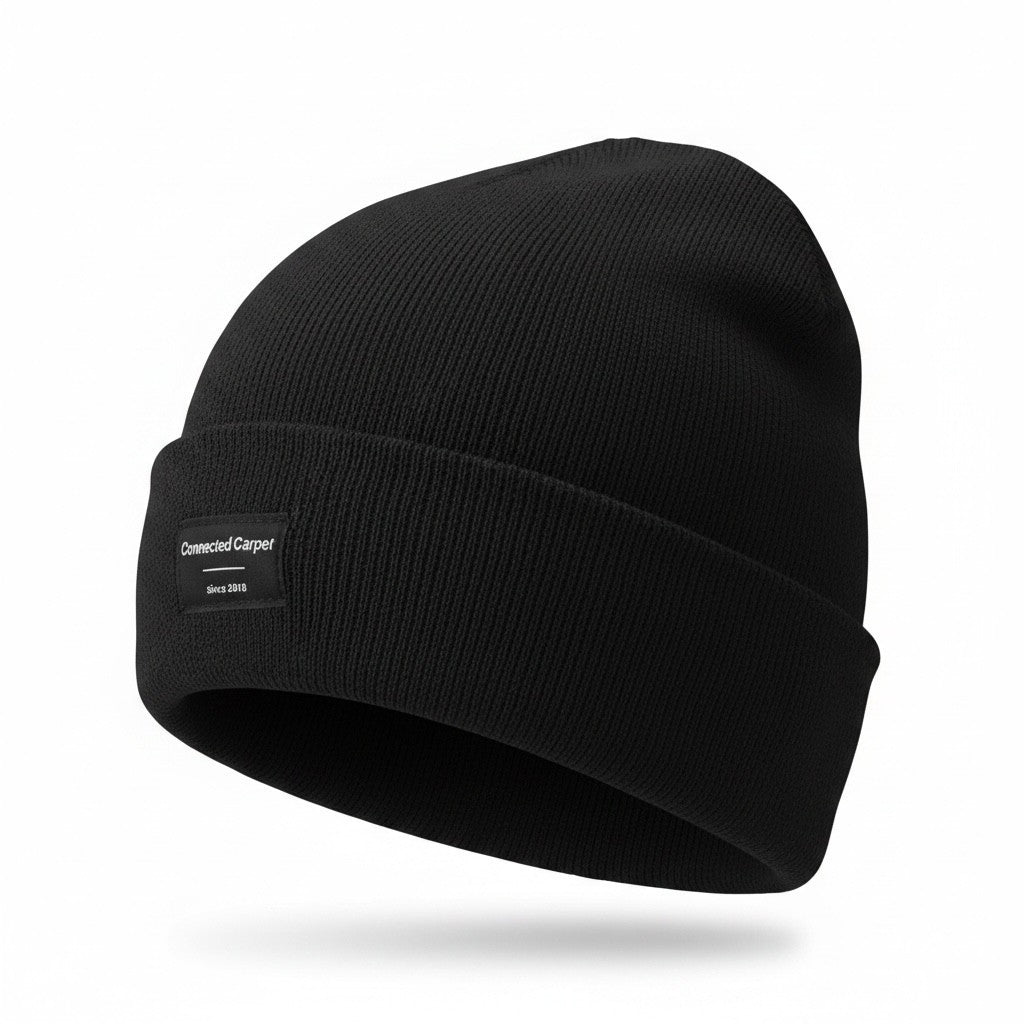 Connected Carper black minimalist beanie made of 100% acrylic with a small branded patch on the cuff