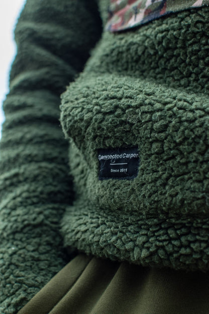 Connected Carper khaki sherpa fleece hoodie with textured fabric and branded patch on the kangaroo pocket